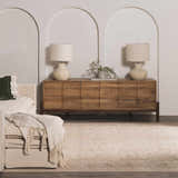 Living room scene with a neutral Fetscher V Vintage Damask Area Rug, wood cabinet, and cream sofa. Roomscene-Rectangle