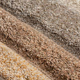 Close-up of the textured Dalyn Carmona CO2 Flax Area Rug, showing beige, brown, and flax color variations.