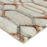 Close-up of the Dalyn Carmona CO7 Linen Area Rug showing beige, chestnut, ivory, paprika, and taupe geometric pattern.