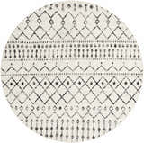 Close-up of a round Scandi Moroccan Trellis Rug. Off-white rug with black and gray diamond and geometric patterns. Design-Round-67
