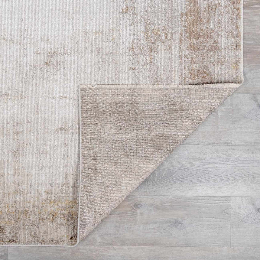 Close-up of the Myrtle Avenue Galey Alix x LIVABLISS GAMY-2303 area rug showing its camel, cream, and brown abstract pattern. Fold