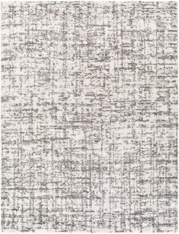 Close-up of the Candra Area Rug; a shag rug in charcoal and white with a subtle grid pattern. Design-Rectangle-710