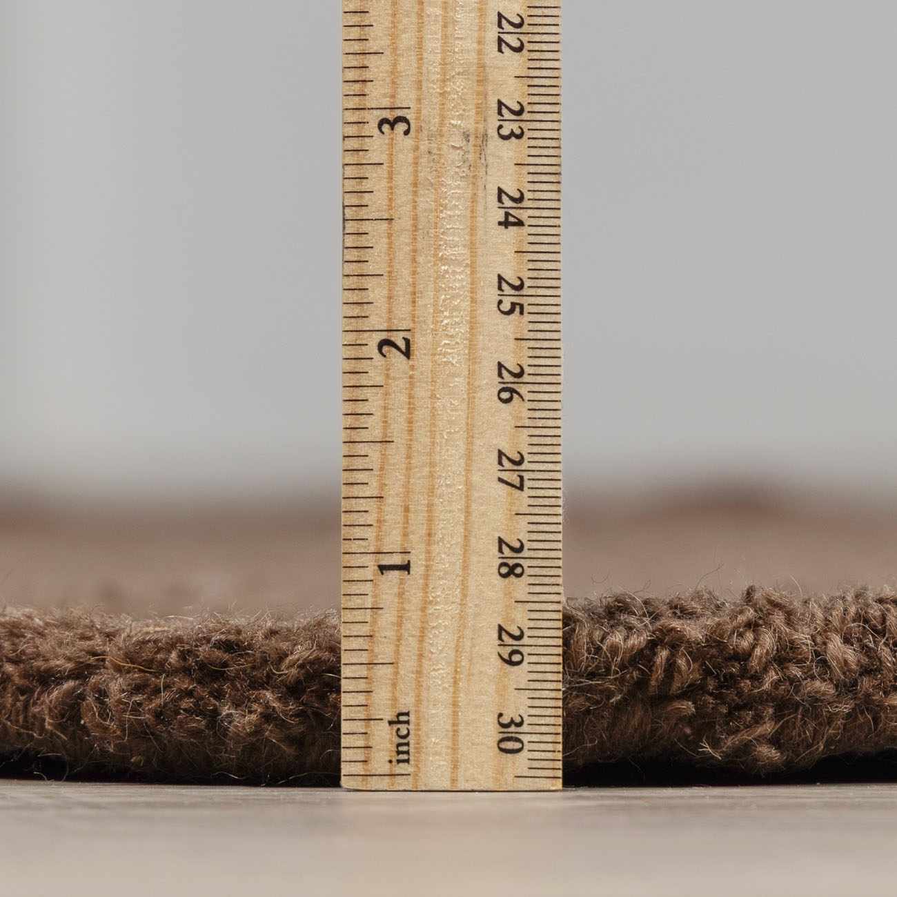 Close-up of the pile height of the hand-tufted Chogan Chocolate Brown Area Rug, made of 100% wool. Pile