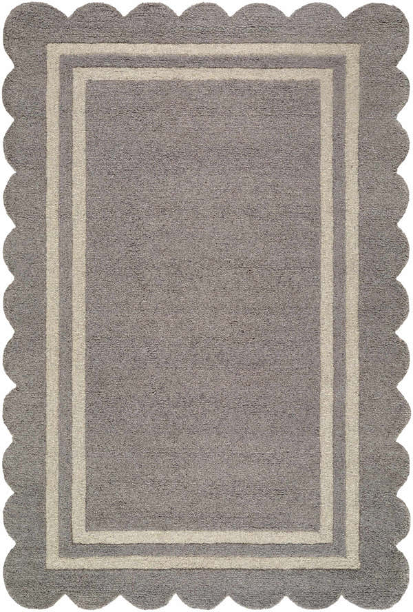 Close-up of the hand-tufted Chogan Slate Gray Area Rug. Features a scalloped edge and a double border in light gray. 100% wool. Design-Rectangle-576