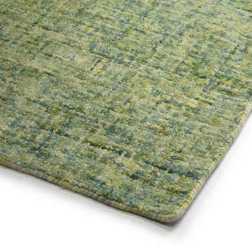 Close-up of the hand-tufted Dalyn Calisa CS5 Kiwi Area Rug. Features a casual design in shades of green, aqua, and gold.