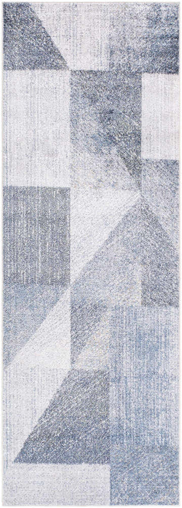Close-up of the Chachi Washable Geometric Rug. Features a contemporary pattern in gray, light gray, and navy. Design-Runner-2773