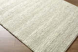 Close-up of the hand woven Clarke Textured Braided Stripe - Dark Beige Area Rug showing wool texture and medium brown color. Corner