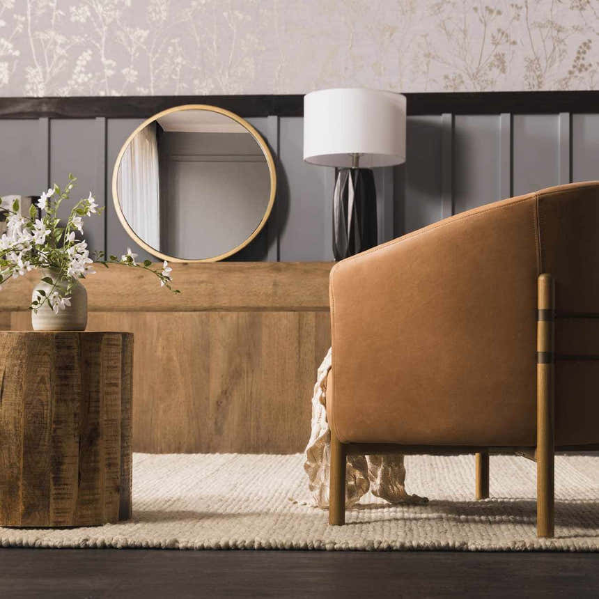 Living room scene with brown leather chair on Clarke Textured Braided Stripe Dark Beige rug. Roomscene-Rectangle