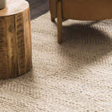 Close up of the Clarke Textured Braided Stripe rug in dark beige, showing its hand woven wool texture. Roomscene-Rectangle