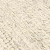 Close-up of the Clarke Textured Braided Stripe Rug in dark beige. Hand-woven wool rug with a chunky, textured design. Texture