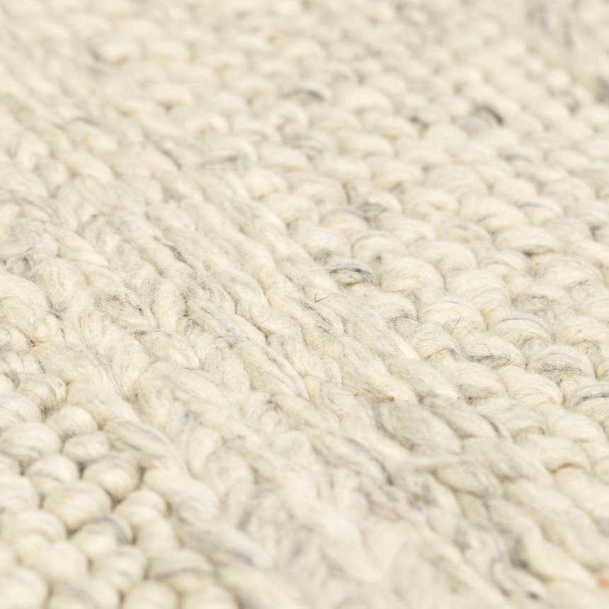 Close-up of the Clarke Textured Braided Stripe Rug in dark beige. Hand-woven wool rug with a chunky, textured design. Texture