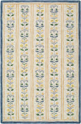 Close-up of the hand-tufted Callen Ivory Area Rug. Features a floral pattern with yellow flowers and a blue border. Design-Rectangle-576