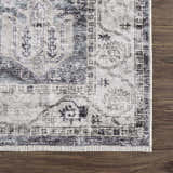 Close-up of the Off White Holi-4602 Washable Area Rug showing its traditional vintage pattern and fringed edge. Swatch