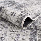 Close-up of the Off White Holi-4602 Washable Area Rug showing the traditional vintage pattern and soft texture. Fold