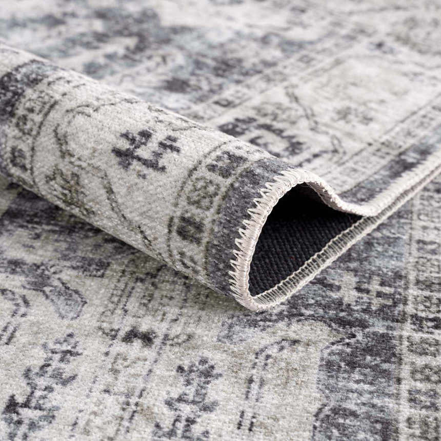 Close-up of the Off White Holi-4602 Washable Area Rug showing the traditional vintage pattern and soft texture. Fold