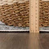 Close-up of the Off White Holi-4602 rug showing the pile height with a ruler and a basket for scale. Pile