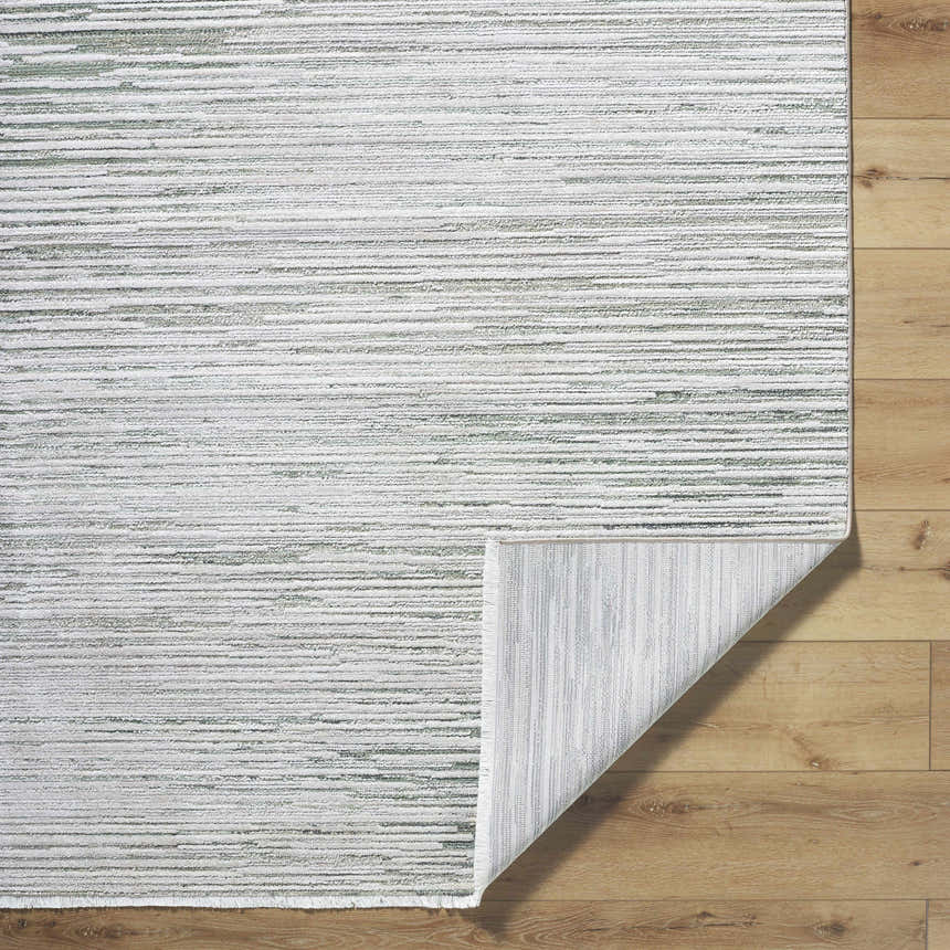 Close-up of the Corwin 3D Striped Washable Area Rug. Cream, gray, and sage stripes on a textured polyester rug. Fold