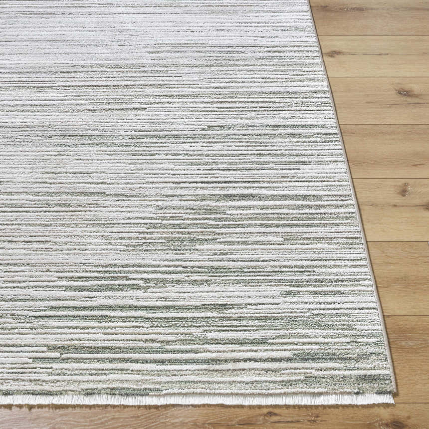 Close-up of the Corwin 3D Striped Washable Area Rug. Cream, gray, sage, and tan stripes on a machine woven polyester rug. Front