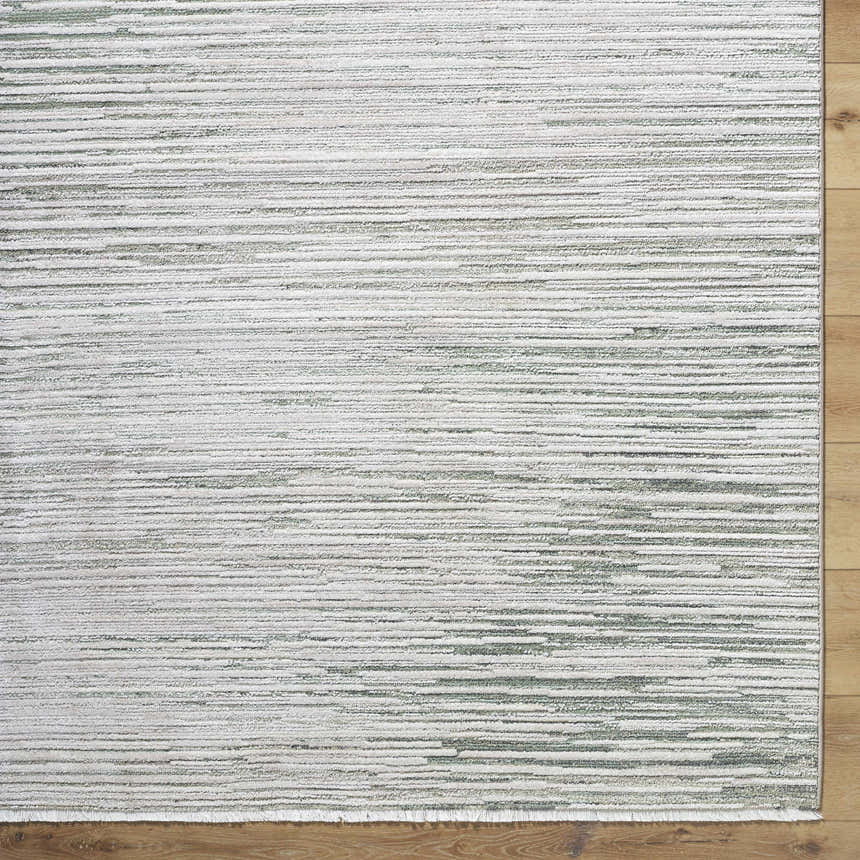 Close-up of the Corwin 3D Striped Washable Area Rug. Cream, gray, sage, and tan horizontal stripes. Contemporary style. Corner