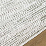 Close-up of the Corwin 3D Striped Washable Area Rug. Cream, gray, and sage stripes with a textured, machine-woven design. Texture