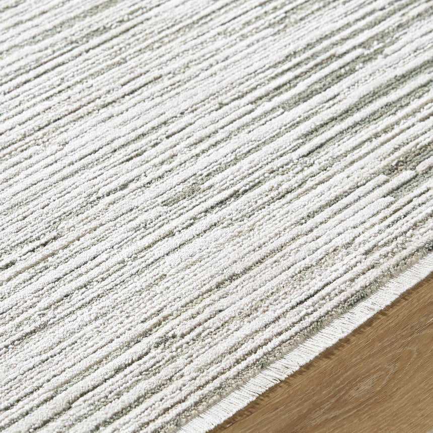 Close-up of the Corwin 3D Striped Washable Area Rug. Cream, gray, and sage stripes with a textured, machine-woven design. Texture