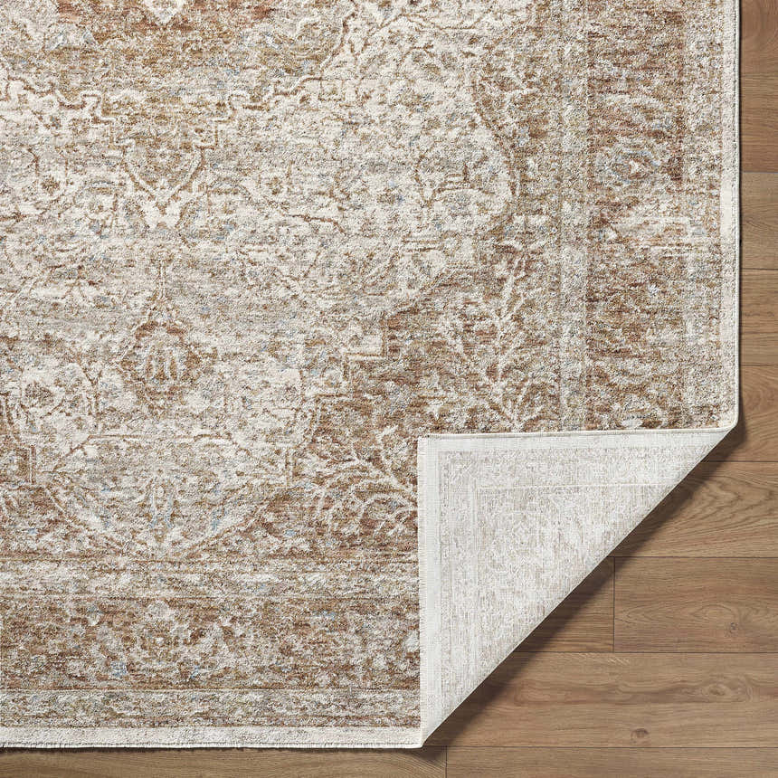 Close-up of the Charae Ivory Area Rug showing beige, sandstone, and taupe traditional pattern and texture. Fold