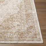 Close-up of the Charae Ivory Area Rug showing beige, sandstone, and taupe traditional pattern on a wood floor. Front