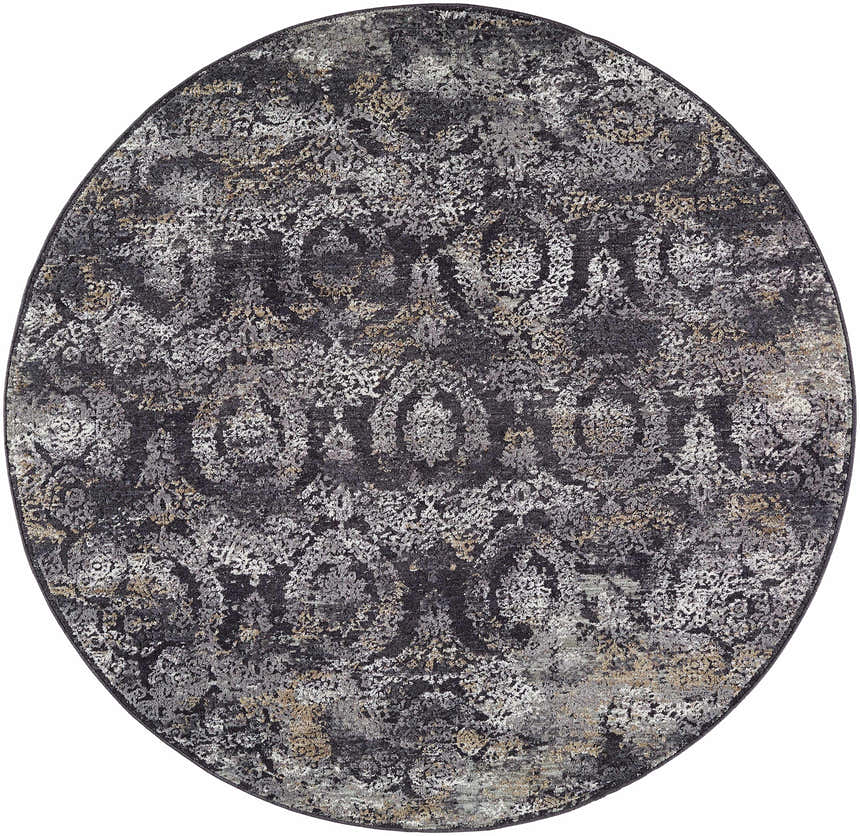 Close-up of the round Alexei Area Rug. Features a traditional pattern in black, charcoal, gray, and tan. Design-Round-53