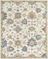Close-up of the Candid Oushak Area Rug, a cream wool rug with light brown, steel blue, and gray floral and vine pattern. Design-Rectangle-810