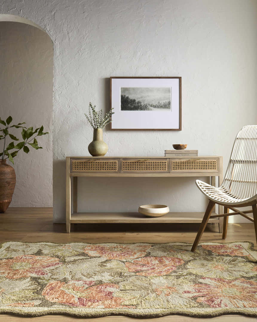 Farmhouse entry with a floral Campos Area Rug, wood console table, white chair, and neutral decor. Roomscene-Rectangle