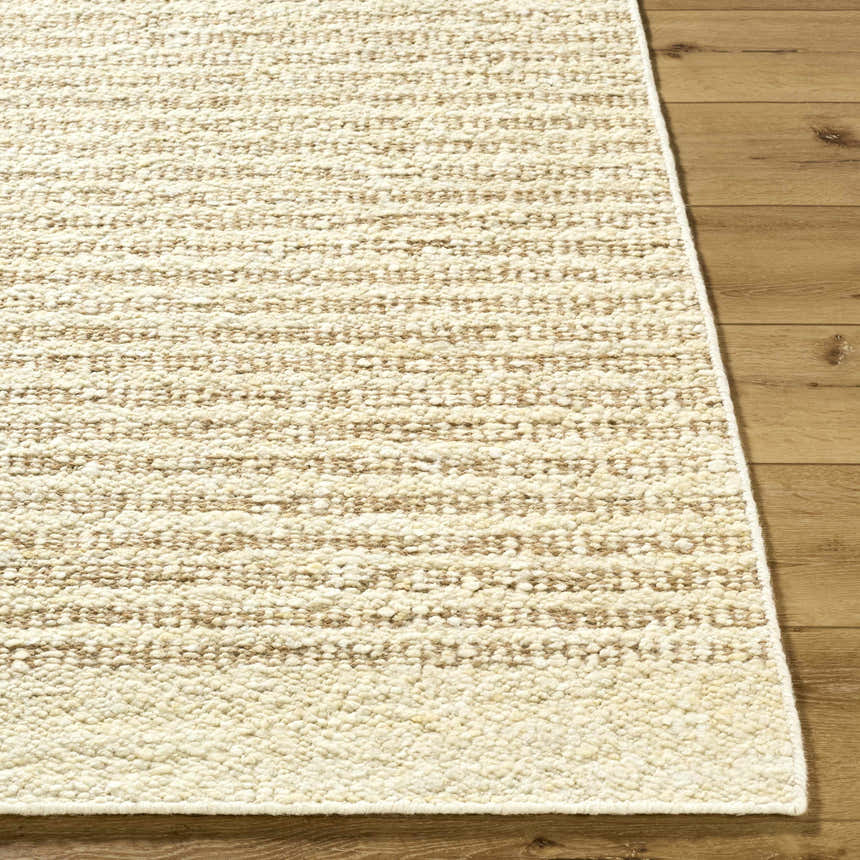 Close-up of the hand woven Arlais Striped Area Rug. Ash, desert sand, and pearl stripes on a textured wool rug. Front