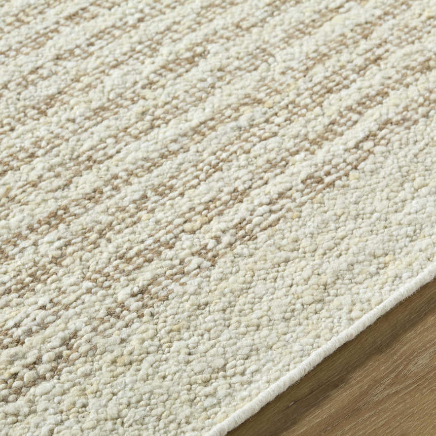 Close-up of the Arlais Striped Area Rug showing its texture, ash, desert sand, and pearl colors. Hand woven wool rug. Texture