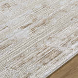 Close-up of the Candie Beige Area Rug. Cream and tan striated design with a soft, textured pile. Contemporary style. Texture