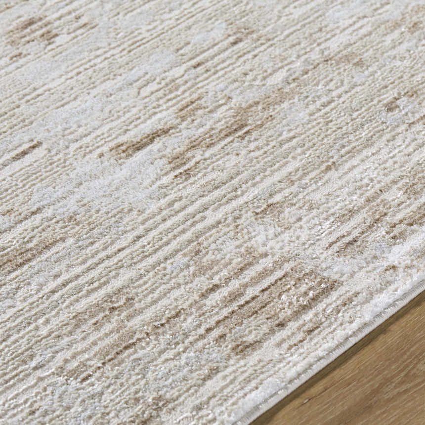 Close-up of the Candie Beige Area Rug. Cream and tan striated design with a soft, textured pile. Contemporary style. Texture