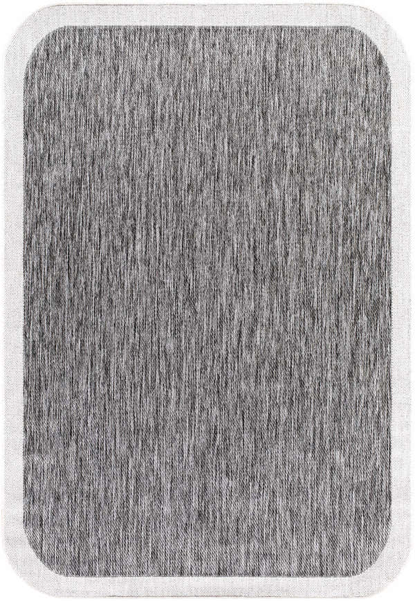 Close-up of the Chetan Charcoal outdoor rug, showing its textured charcoal and cream design with a cream border. Design-Rectangle-537