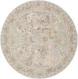 Close-up of a round Chikao Beige Area Rug with a traditional floral pattern in beige, cream, mustard, slate blue, and teal. Design-Round-53