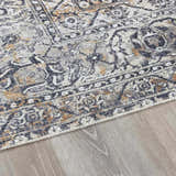 Close-up of the Dagatan Washable Area Rug, showcasing its beige, black, and gray traditional oriental pattern and soft texture. Pile