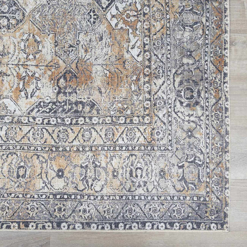 Close-up of the beige, black, and gray Dagatan Washable Area Rug showcasing its traditional oriental pattern and soft texture. Swatch