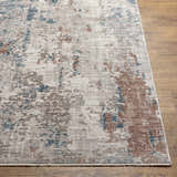 Close-up of the Danlugan Area Rug showing a contemporary charcoal, cream, brown, and blue abstract pattern. Front