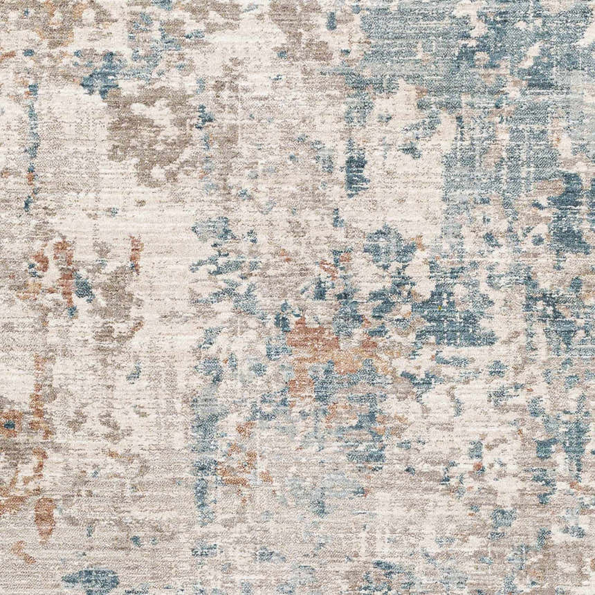 Close up of the Danlugan Area Rug. Abstract design in charcoal, cream, dusty pink, medium brown, and pale blue. Swatch