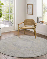 Bright living room with a round Deena Thick Luxe Area Rug in gray, brown, and teal under a woven chair. Roomscene-Round