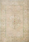 Close-up of the Luciana II rug. Beige rug with a traditional medallion pattern in light green and peach tones. Design-Rectangle