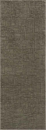 Close-up of the Leanna Green Washable Area Rug, showcasing its geometric pattern and textured gray-green color. Design-Runner