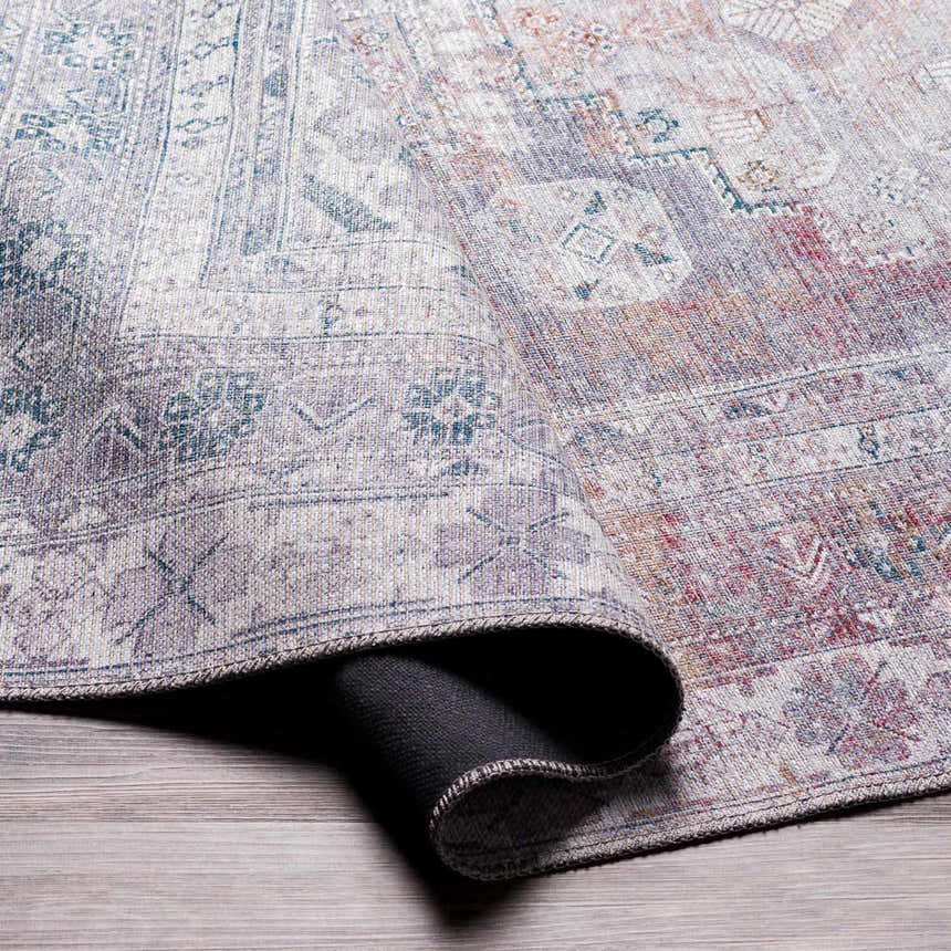 Close-up of the Livabliss Colin Surya CLN-2304 rug, showcasing its charcoal, cream, and red traditional pattern and machine-woven texture. Fold