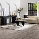 Living room scene with Ababuo Black Area Rug, cream sofa, black console table, and round coffee table. Modern, neutral tones. Roomscene-Rectangle