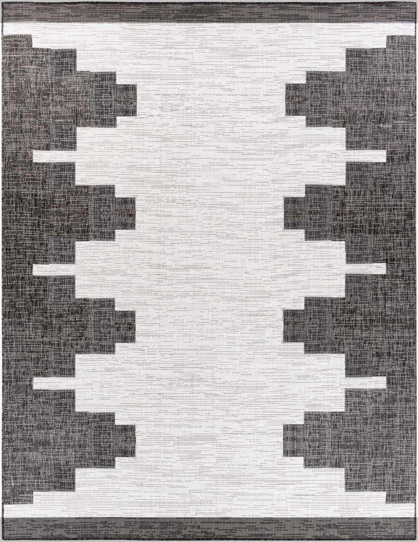 Close-up of the New Djugun Area Rug. Black, charcoal, and off-white geometric Southwestern design. Design-Rectangle