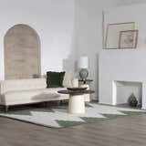 Living room scene with a beige sofa and the Ababuo Bone Area Rug featuring a geometric Southwestern design. Roomscene-Rectangle