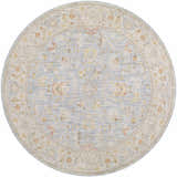 Close-up of a round Livabliss Avant Garde AVT-2371 area rug. Features a traditional floral pattern in gray, taupe, and mustard tones. Design-Round-53