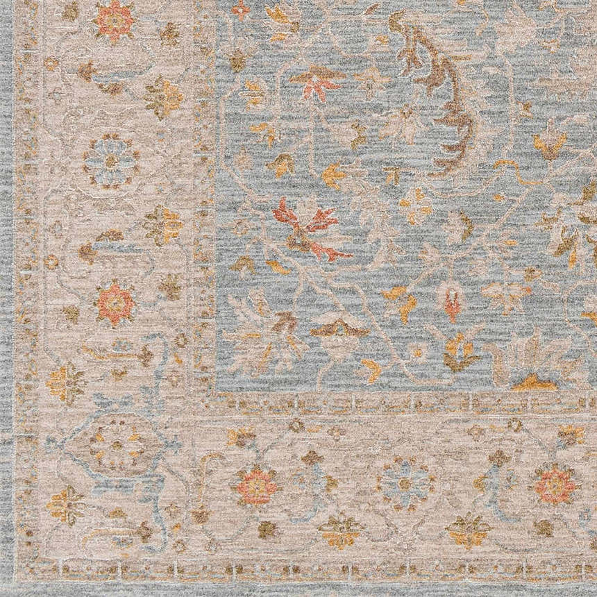 Close-up of the Livabliss Avant Garde AVT-2371 rug. Features a traditional floral pattern in taupe, gray, mustard, and brown. Swatch