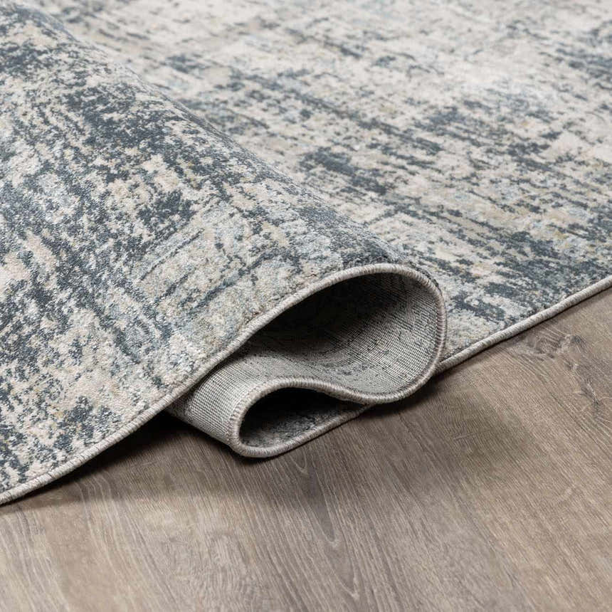 Close up of the Eltham Thick Luxe Rug in light gray and navy showing texture and construction. Fold